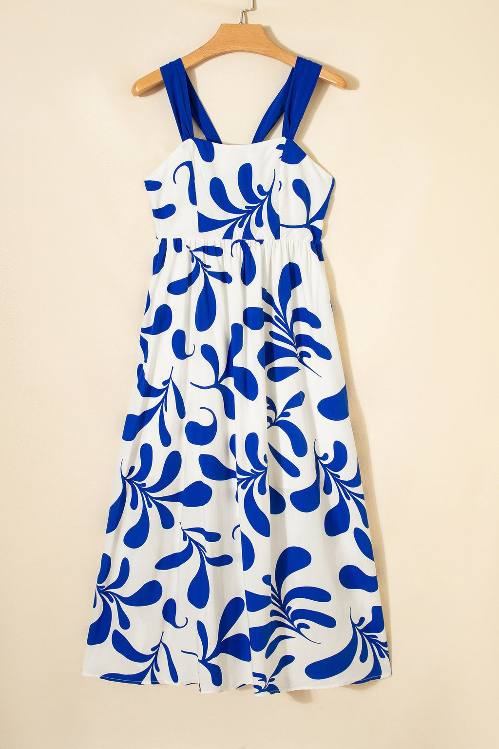 Vestido largo sin mangas con estampado floral azul y lazo cruzado en la espalda